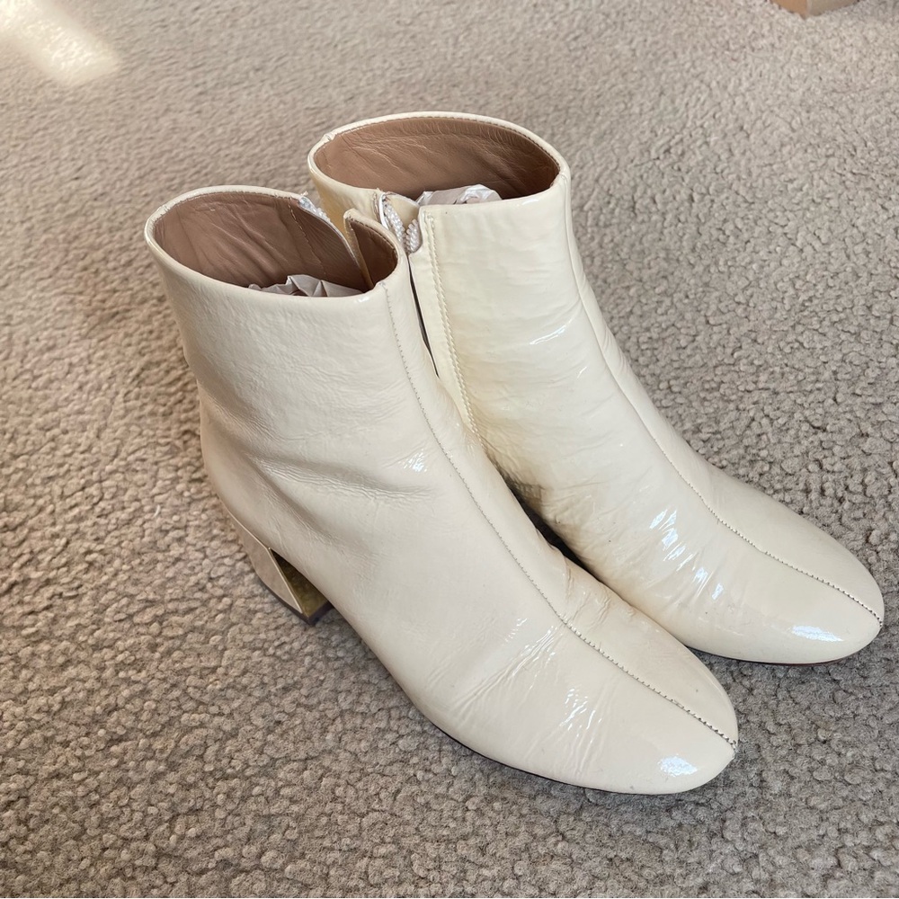 Tory Burch cream color patent leather heeled ankle boots